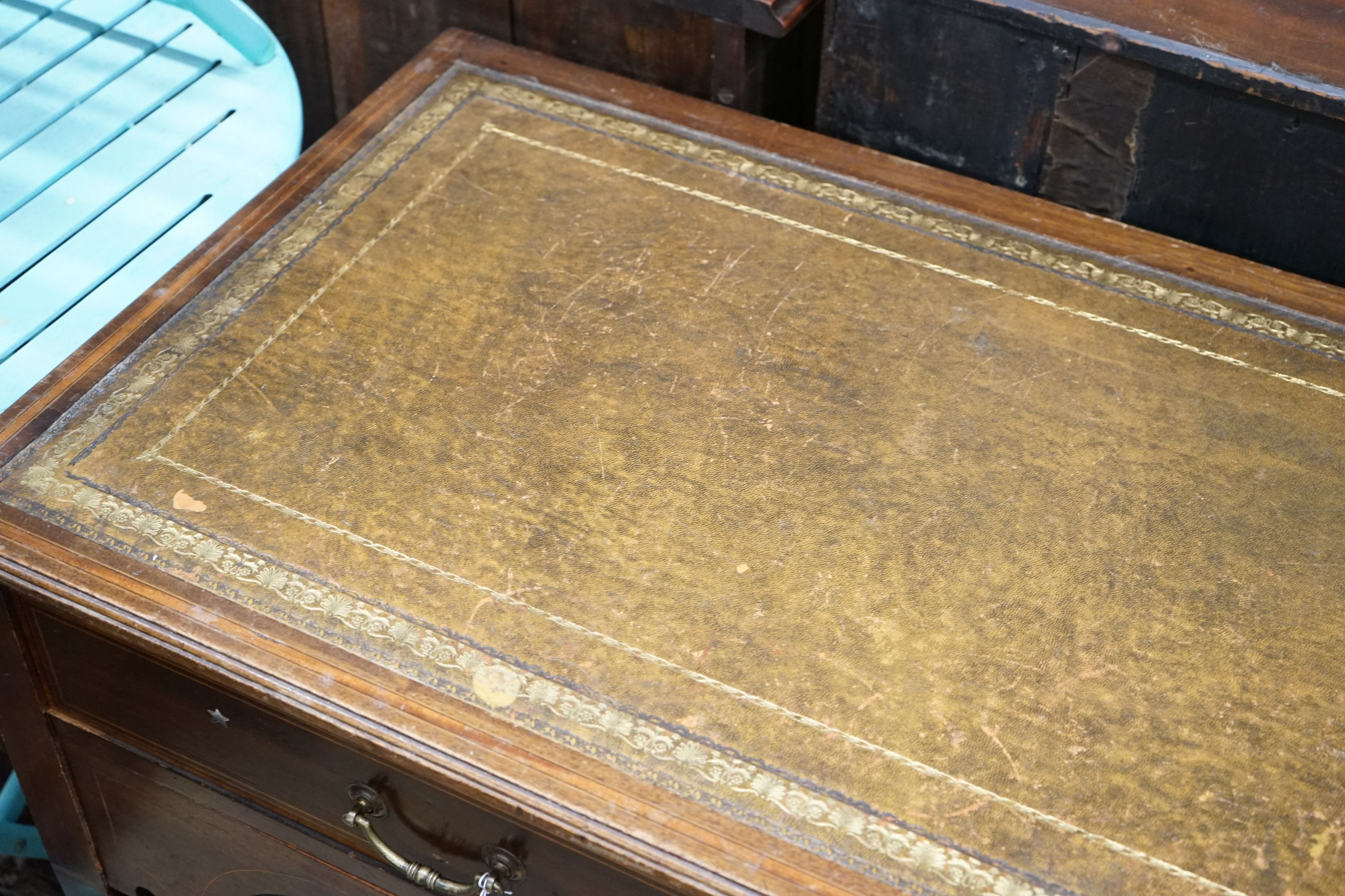 An Edwardian satinwood banded mahogany writing table, width 115cm, depth 53cm, height 72cm